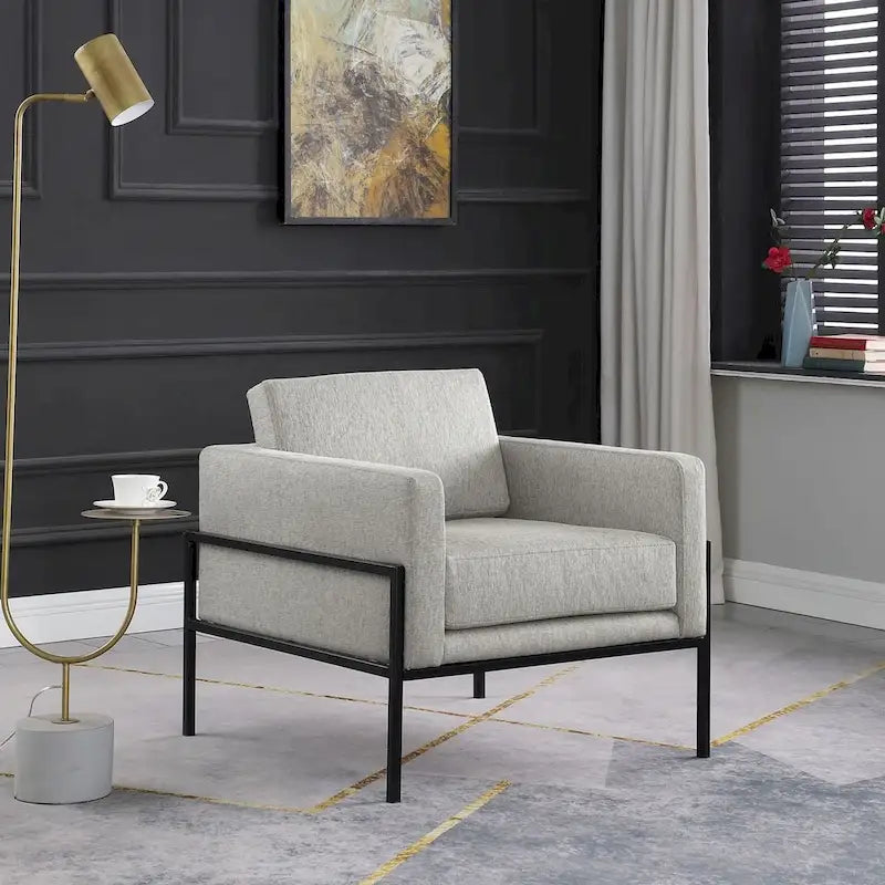 Sillón club tapizado de diseño moderno con estructura de metal negro mate