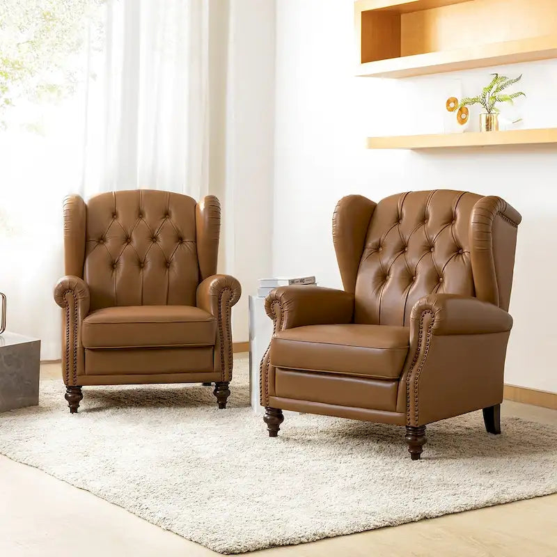 Poltrona wingback in similpelle con schienale alto e gambe in legno massello